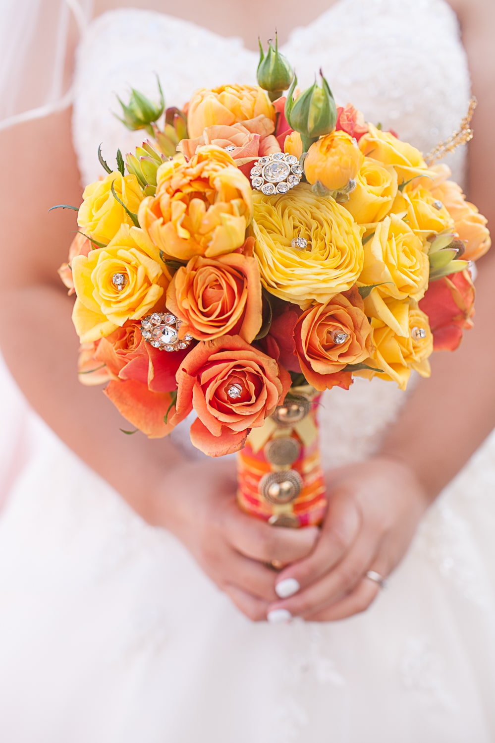 orange and yellow wedding bouquet with jewels. 