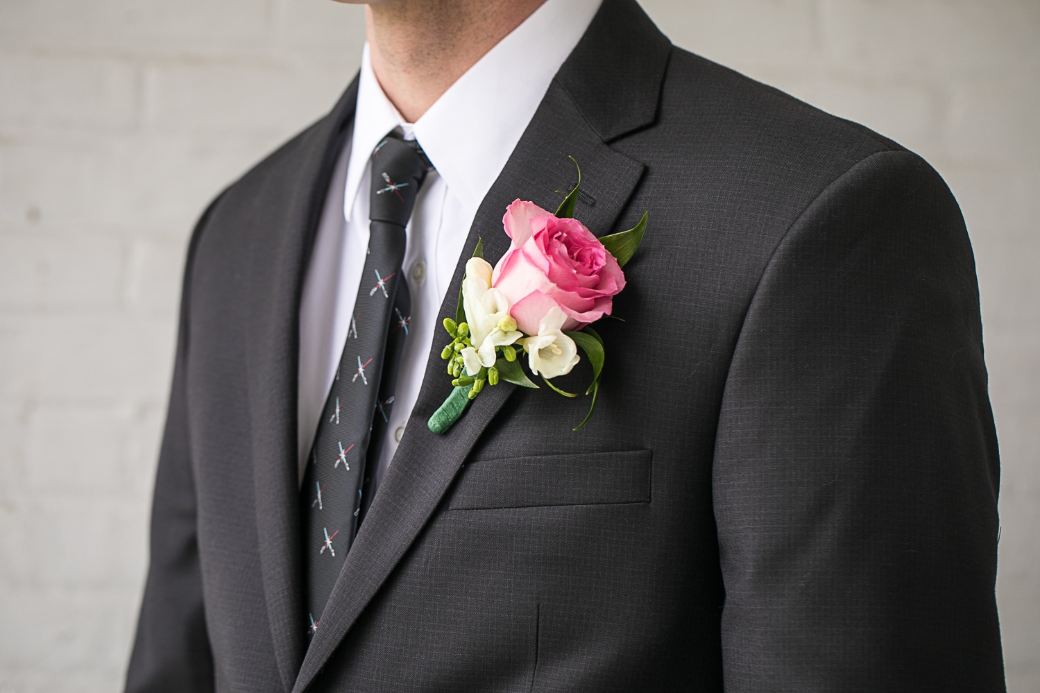 groom details. Lightsaber tie and boutonniere