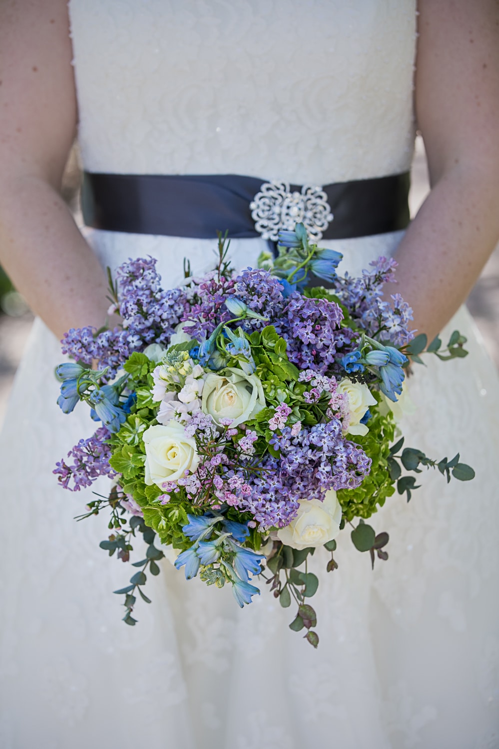 Wedding bouquet with lilacs and white roses