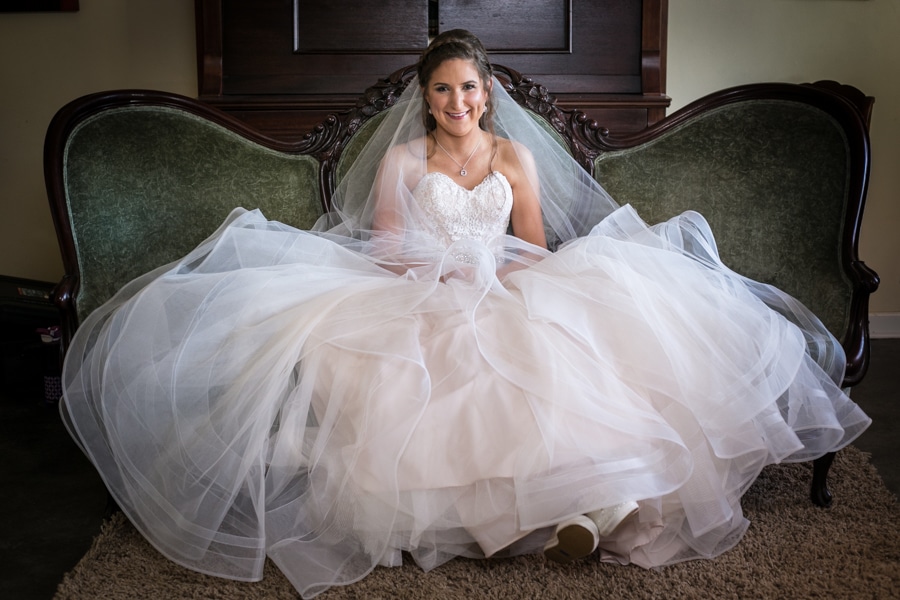 bride sitting on vintage couch