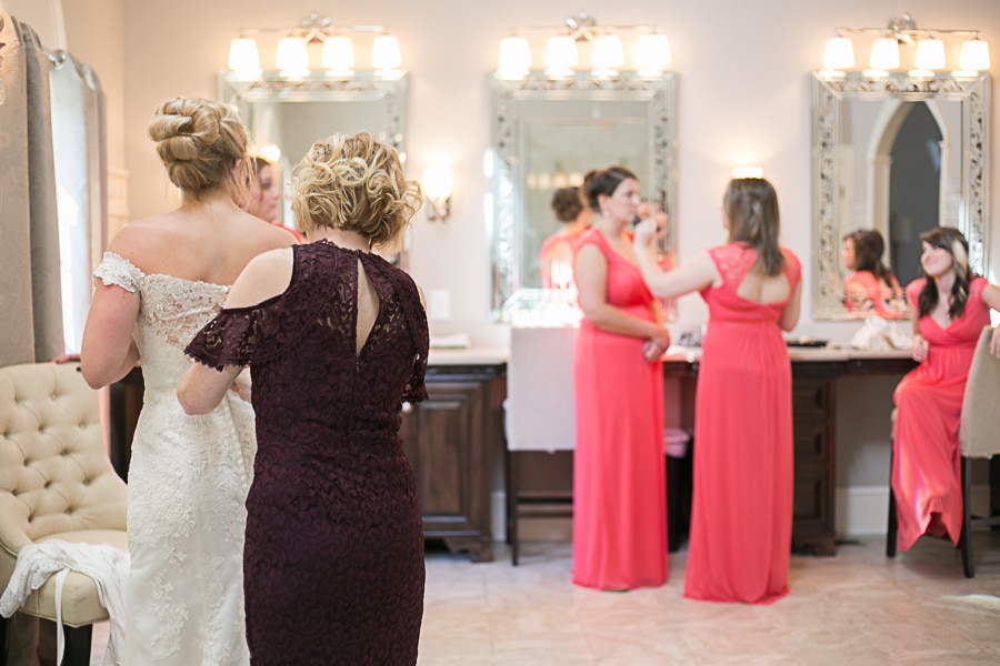 brides mom helping her get ready