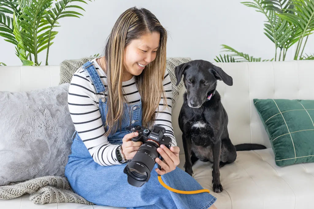 dog mom showing the back of her camera screen to her dog