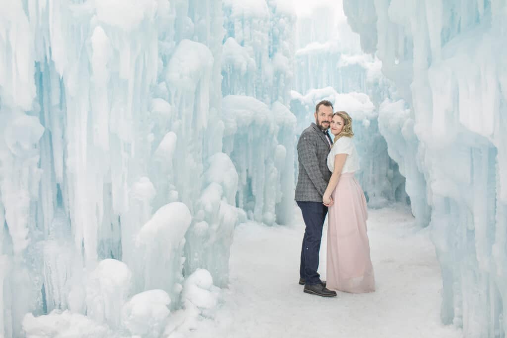 couple standing in ice castle