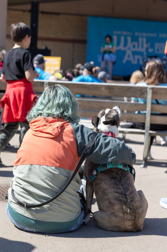 woman and dog at walk for animals